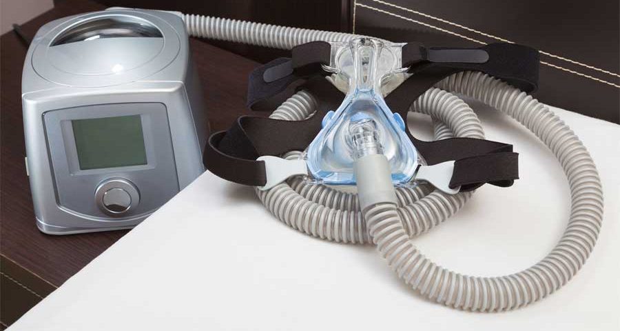 Photo of Sleep Apnea CPAP mask, hose, headgear, and machine